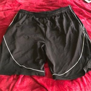 Black with white trim basketball shorts.